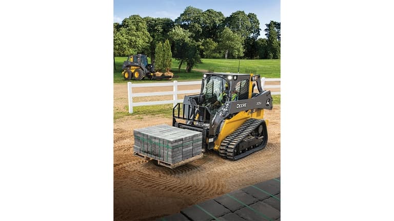 A 325G Compact Track Loader with pallet attachment moves a pallet of bricks. A 332G skid steer with nursery fork attachment moves two trees in the background. | 4re Equipment