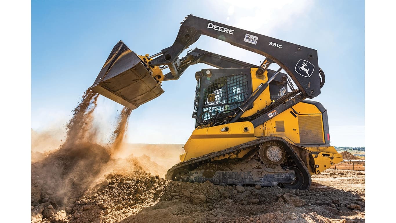 A 331G Compact Track Loader dumping dirt at a worksite. | 4re Equipment | ID: 331gxt