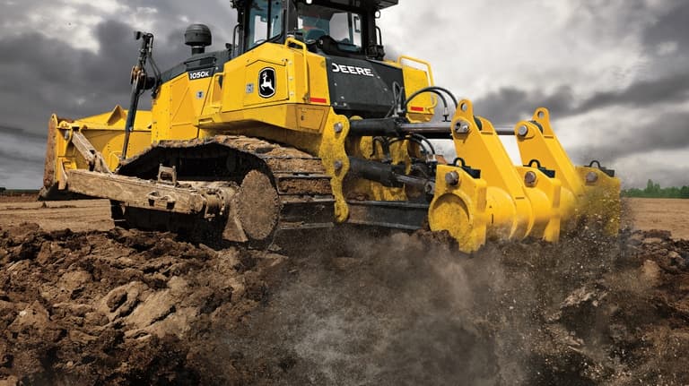 Rear-view of a 1050K Dozer at a worksite. | 4re Equipment