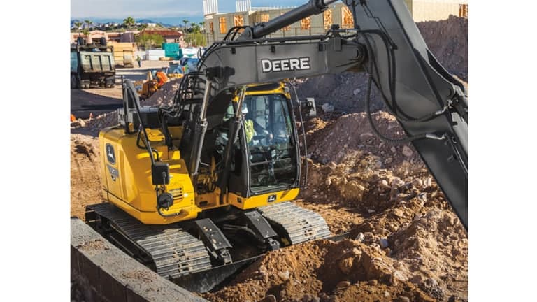 A close-up of the 135P-Tier Excavator cab at a worksite. | 4re Equipment