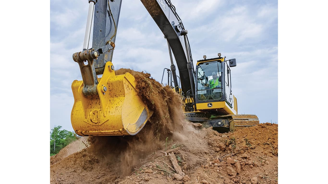An operator using a 210P-Tier Excavator to scoop dirt from the top of a stockpile. | 4re Equipment | ID: 210PEXFT4