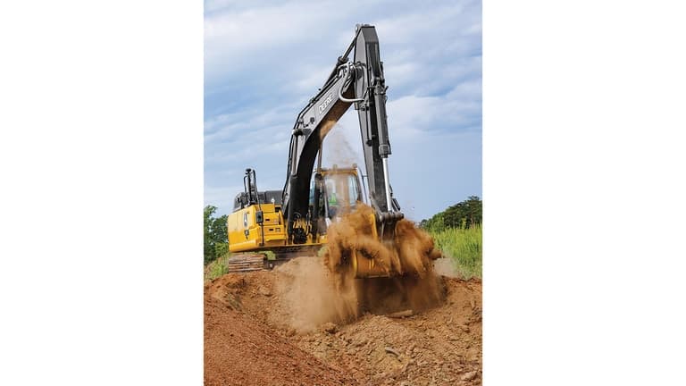 An operator using a 210P-Tier Excavator to move dirt with a green field and trees in the background. | 4re Equipment
