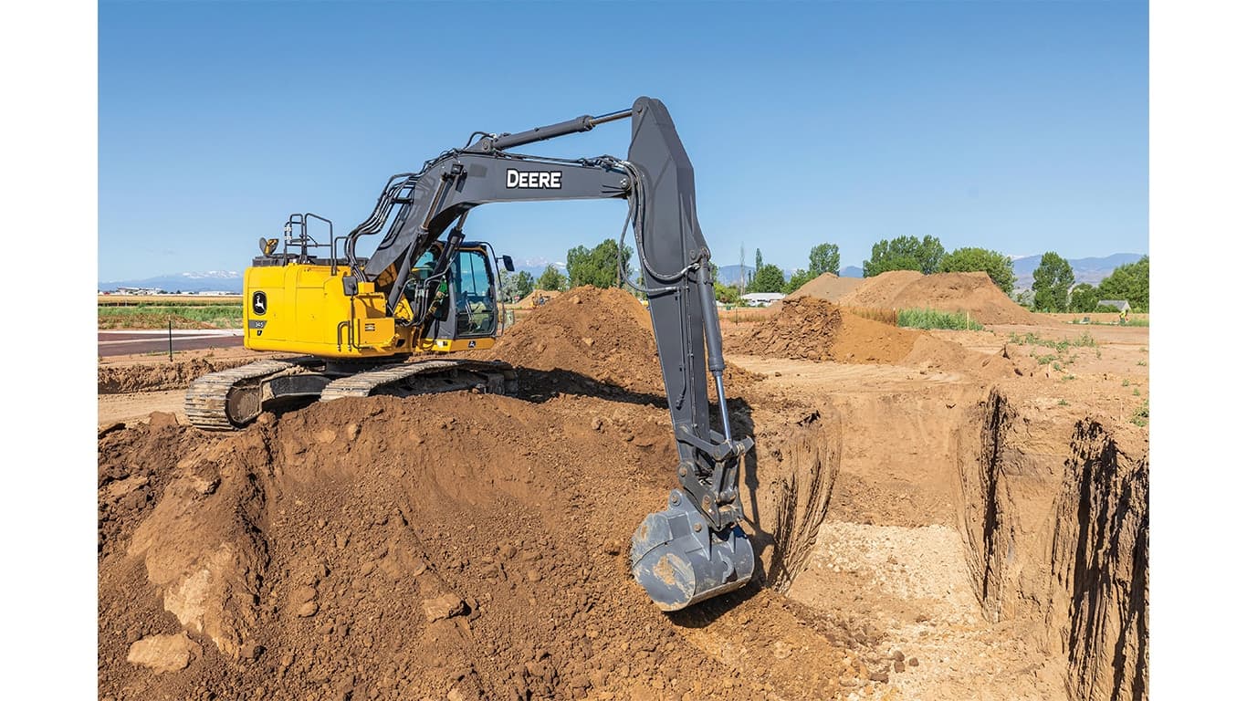 A 345P-Tier Excavator scooping dirt out of a pit at a worksite. | 4re Equipment | ID: 345PEXFT4