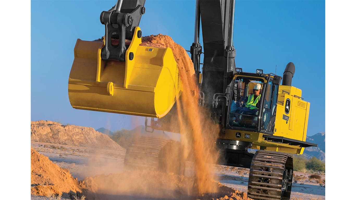 An operator using an 870P-Tier Excavator to scoop dirt at a worksite. | 4re Equipment | ID: 870PEXFT4